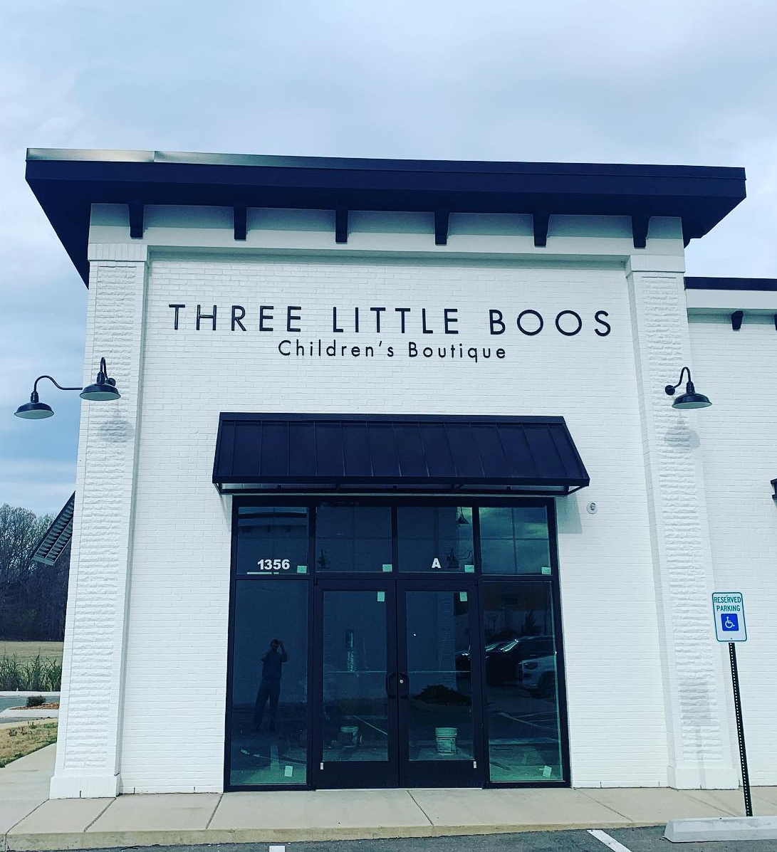 THREE LITTLE BOOS storefront